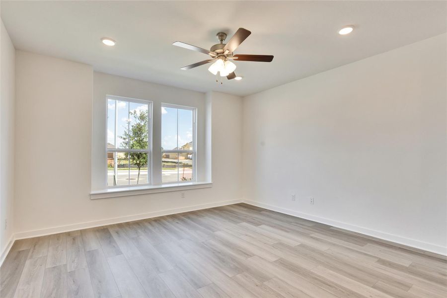 Spare room with light wood-style floors, recessed lighting, and ceiling fan Spare room with light wood-style floors, recessed lighting, and ceiling fan