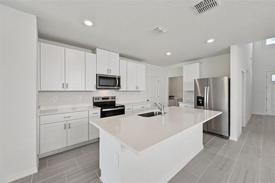 Furnished interior view inside a new home in Salt Meadows - Premier Series, Parrish (Image 9).