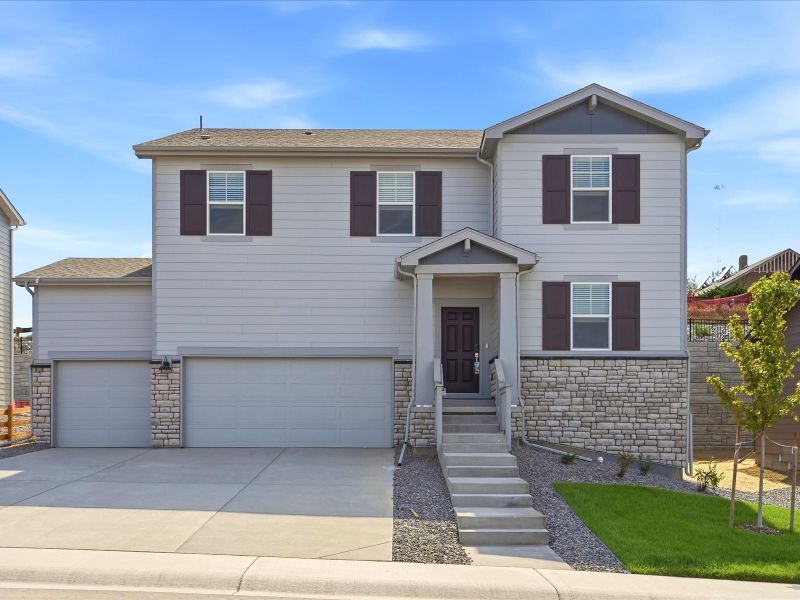 Front exterior of a new home in Poudre Heights: The Lakes Collection, Windsor, CO, highlighting curb appeal (Image 1). Front exterior of a new home in Poudre Heights: The Lakes Collection, Windsor, CO, highlighting curb appeal (Image 1).