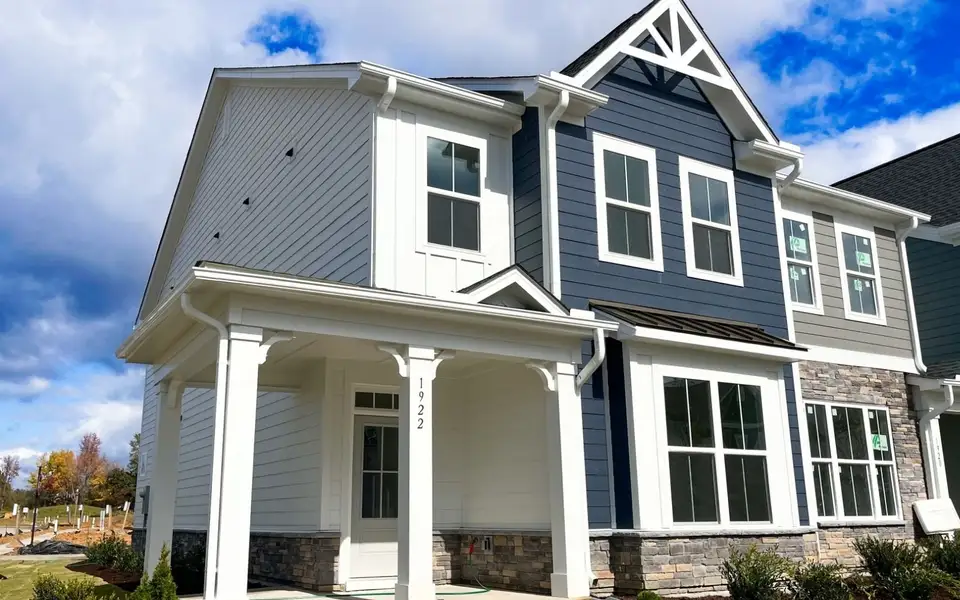Front exterior of a new home in Wendell Falls, Wendell, NC, highlighting curb appeal (Image 1). Front exterior of a new home in Wendell Falls, Wendell, NC, highlighting curb appeal (Image 1).