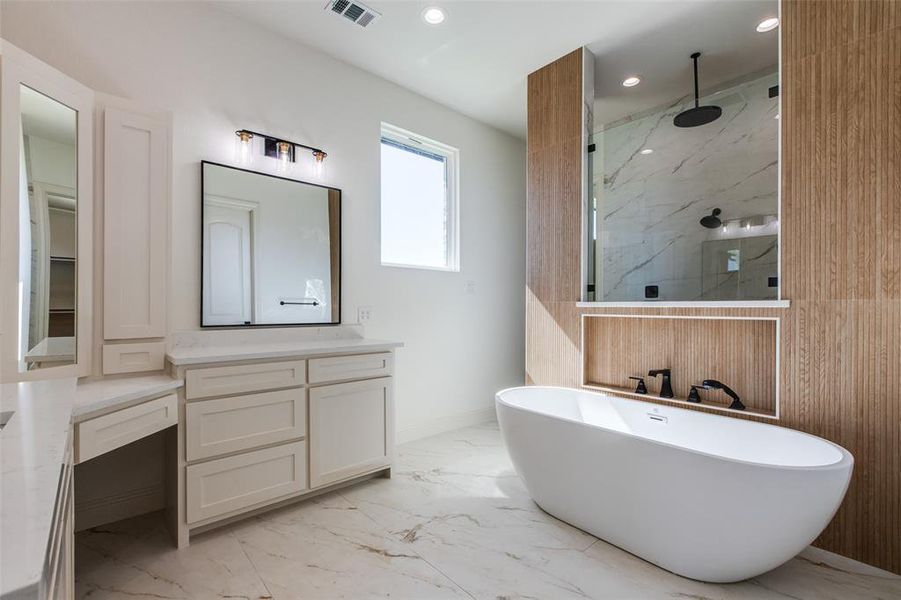 Bathroom with vanity and separate shower and tub