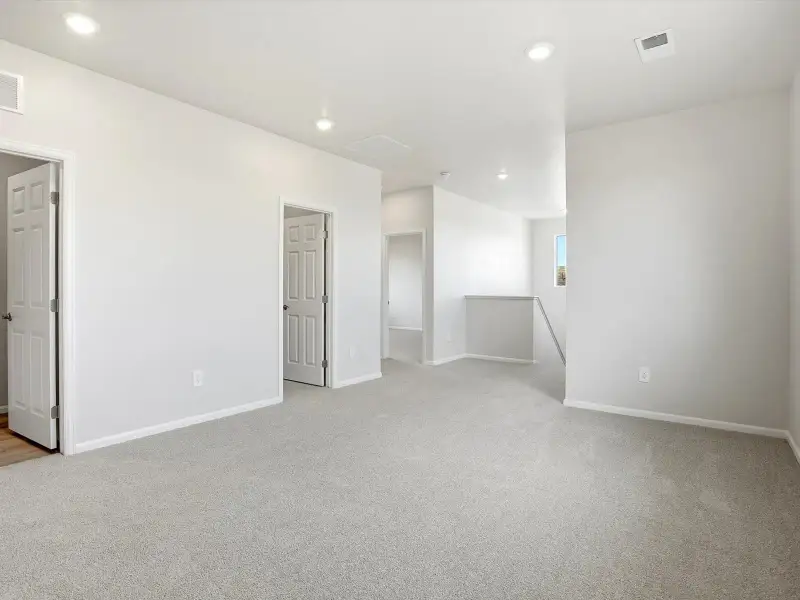 Spacious, unfurnished interior of a new home in Poudre Heights: The Alpine Collection, Windsor (Image 11).