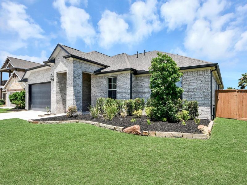 Front exterior of a new home in Lago Mar, Texas City, TX, highlighting curb appeal (Image 27).