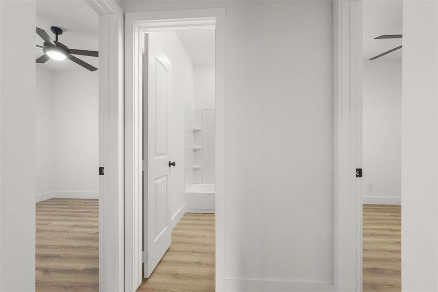 Corridor featuring light hardwood / wood-style floors