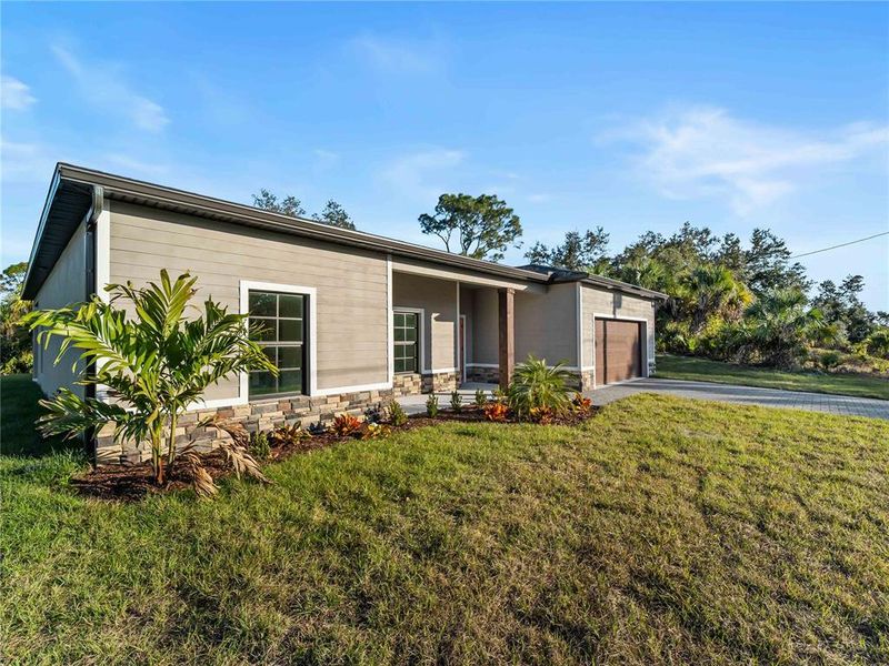 Exterior details and patio area of a home in , North Port (Image 37).