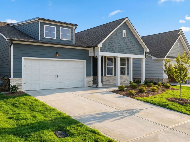 Front exterior of a new home in Kelly Preserve, Loganville, GA, highlighting curb appeal (Image 2). Front exterior of a new home in Kelly Preserve, Loganville, GA, highlighting curb appeal (Image 2).