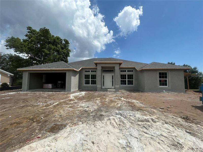 Front exterior of a new home in Deep Creek, Punta Gorda, FL, highlighting curb appeal (Image 2).