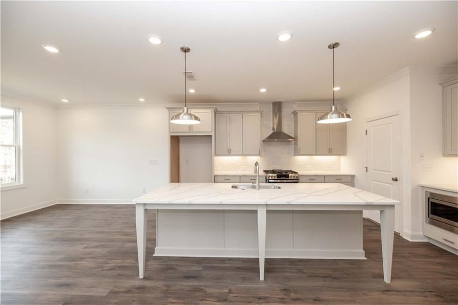 Dining area off of the kitchen - nice open area for a good size kitchen or dining room table. Pictures represent a previously built home, not the actual home.