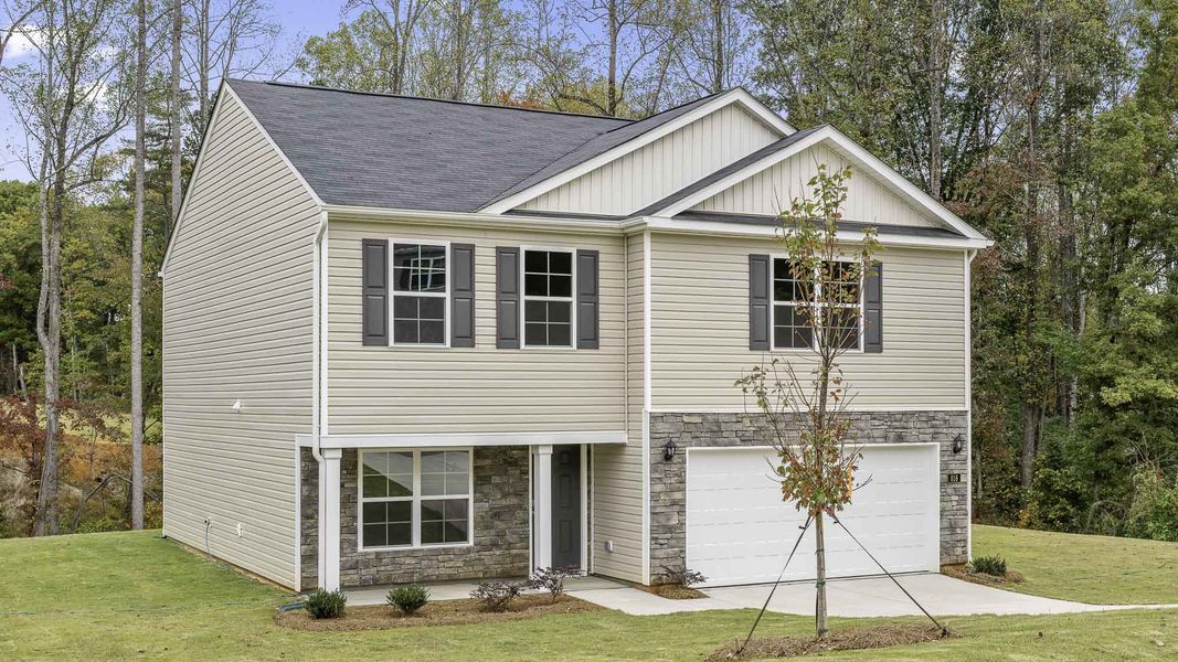 Front exterior of a new home in Waverly Place, Linwood, NC, highlighting curb appeal (Image 2). Front exterior of a new home in Waverly Place, Linwood, NC, highlighting curb appeal (Image 2).