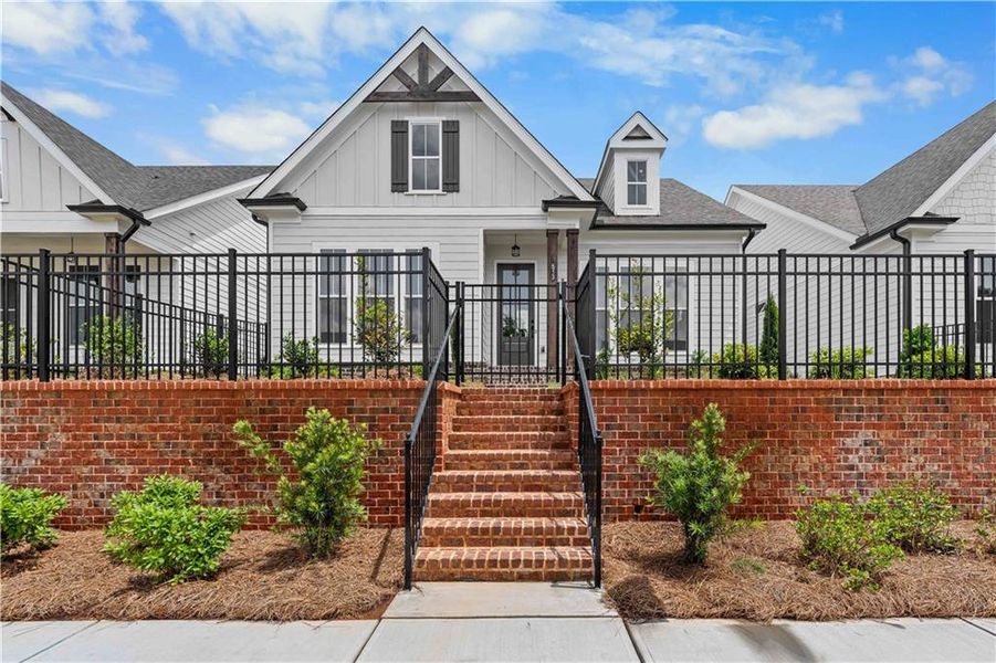 Front exterior of a new home in Promenade at Sawnee Village, Cumming, GA, highlighting curb appeal (Image 22).