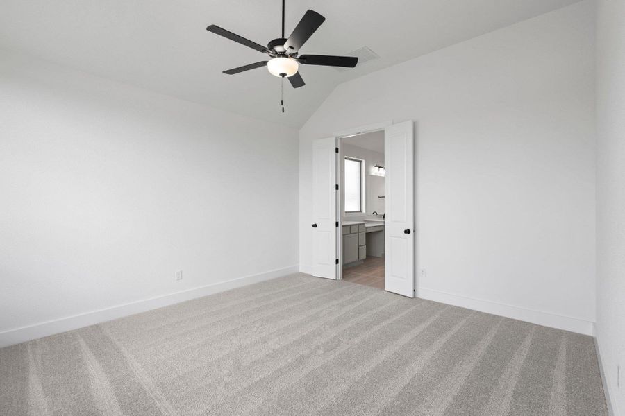 Primary Bedroom with elevated ceiling