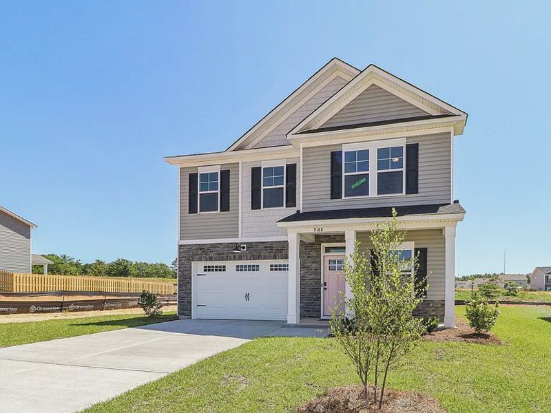 Front exterior of a new home in Providence Station at Trolley Run, Aiken, SC, highlighting curb appeal (Image 14). Front exterior of a new home in Providence Station at Trolley Run, Aiken, SC, highlighting curb appeal (Image 14).