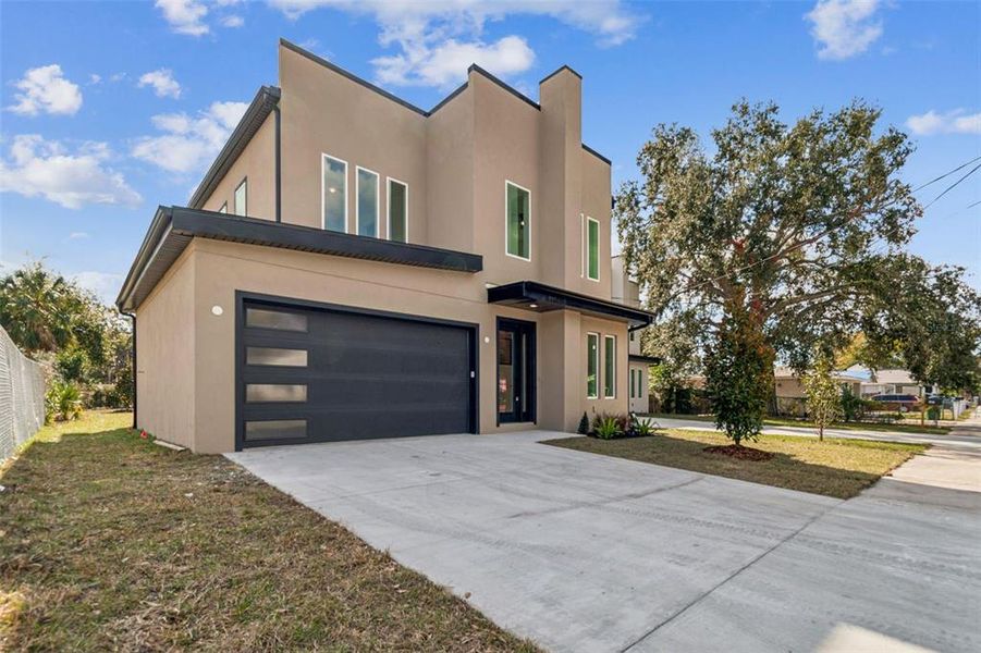 Front exterior of a new home in , Tampa, FL, highlighting curb appeal (Image 33).