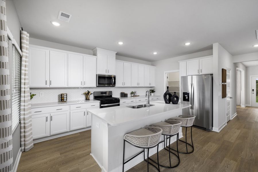 Furnished interior view inside a new home in The Farm at Wells Creek - Signature Collection, Gray Court (Image 5).
