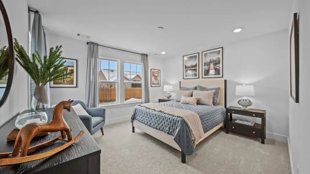 Highly functional bedroom with walk-in closet and tasteful carpet for a restful retreat Highly functional bedroom with walk-in closet and tasteful carpet for a restful retreat