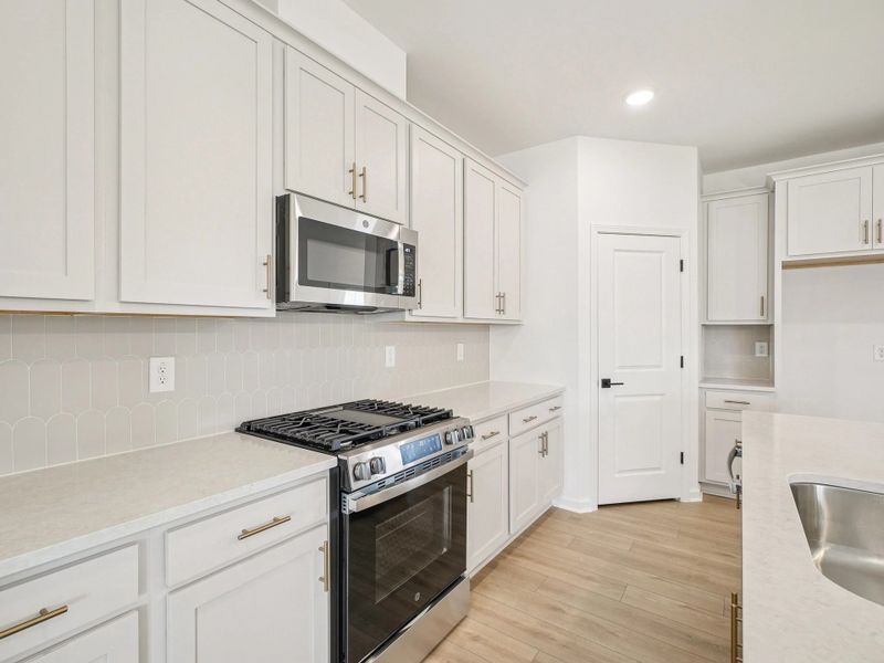 Kitchen featuring the AW Collection® Serene - Clean lines and earthy textures define the space.