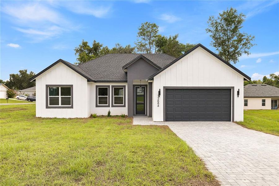 Front exterior of a new home in , Ocala, FL, highlighting curb appeal (Image 2). Front exterior of a new home in , Ocala, FL, highlighting curb appeal (Image 2).