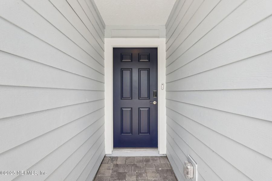 Exterior details and patio area of a home in Colbert Landings, Palm Coast (Image 3).