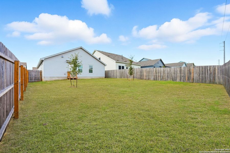 Exterior details and patio area of a home in Lodi Grove, Floresville (Image 29).
