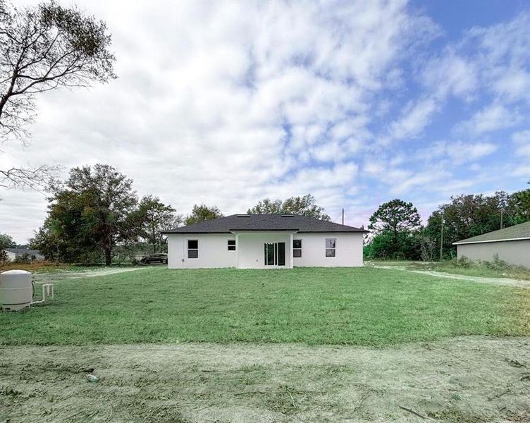 Front exterior of a new home in , Ocklawaha, FL, highlighting curb appeal (Image 18).