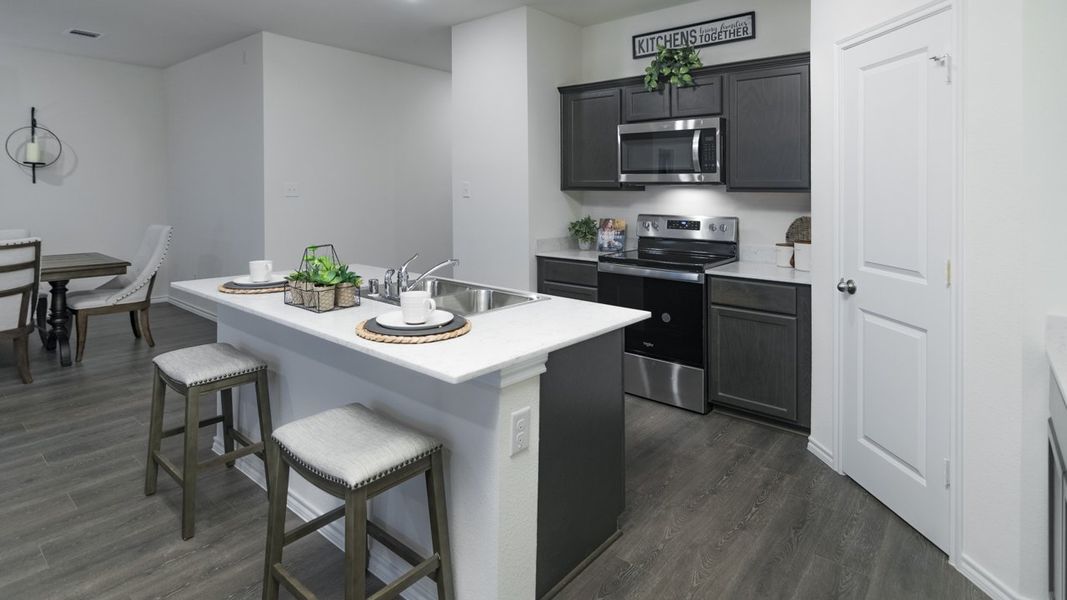 Representative furnished interior of a home built from the X40J Justin by D.R. Horton in Valor Farms, Royse City (Image 9).