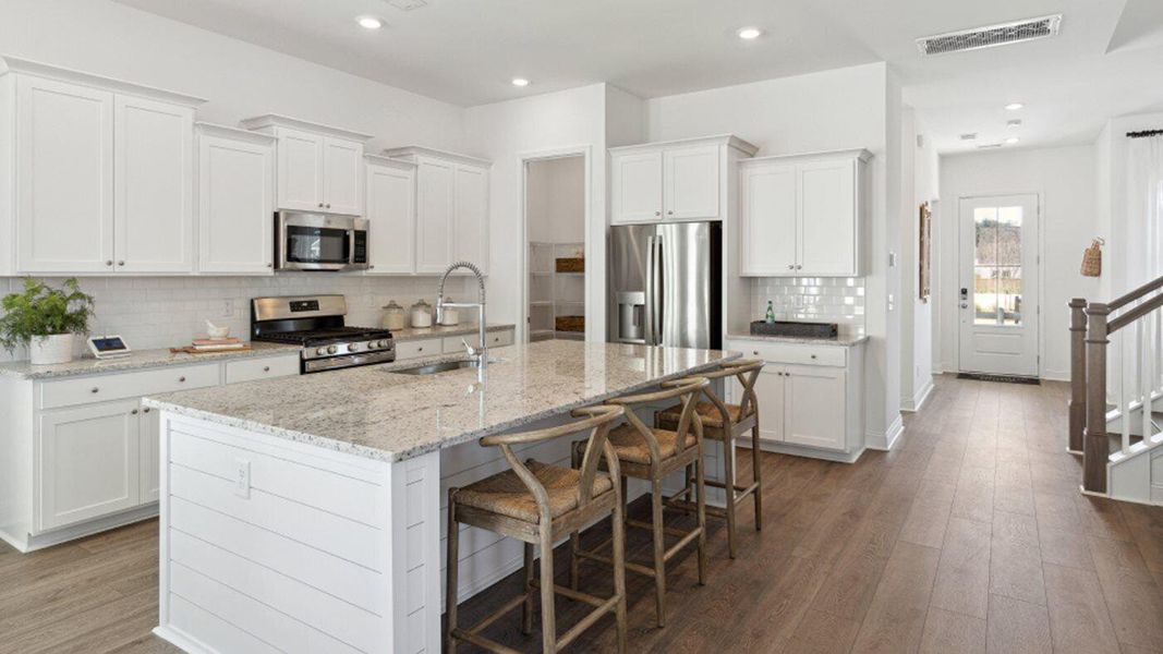 Furnished interior view inside a new home in Carnes Crossroads: Row Collection, Summerville (Image 6). Furnished interior view inside a new home in Carnes Crossroads: Row Collection, Summerville (Image 6).