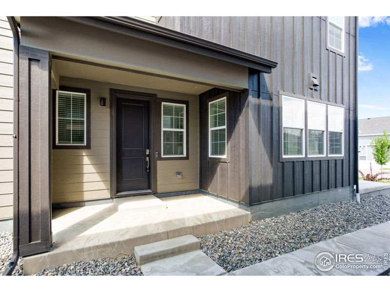 Front exterior of a new home in Westside Crossing Townhomes, Berthoud, CO, highlighting curb appeal (Image 20).