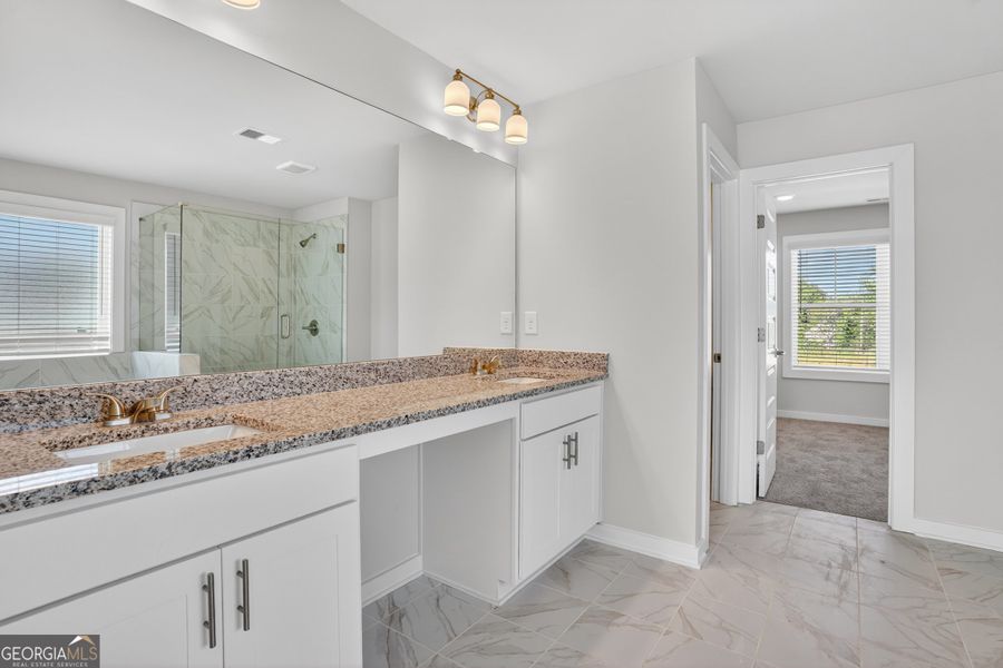 Furnished interior view inside a new home in The Fairways at Mirror Lake, Villa Rica (Image 30).