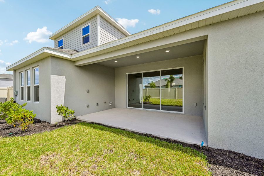Exterior details and patio area of a home in Firethorn, Parrish (Image 15).
