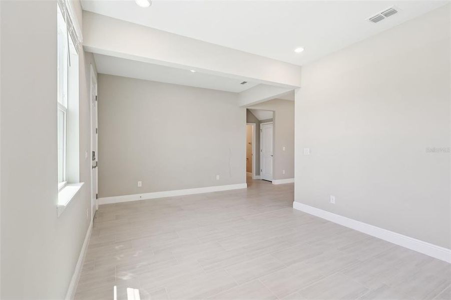 Spacious, unfurnished interior of a new home in Legends Preserve - Signature Series, Daytona Beach (Image 21).