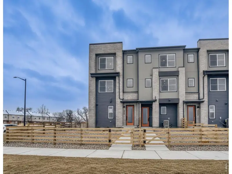 Front exterior of a new home in Waterfield, Fort Collins, CO, highlighting curb appeal (Image 1). Front exterior of a new home in Waterfield, Fort Collins, CO, highlighting curb appeal (Image 1).