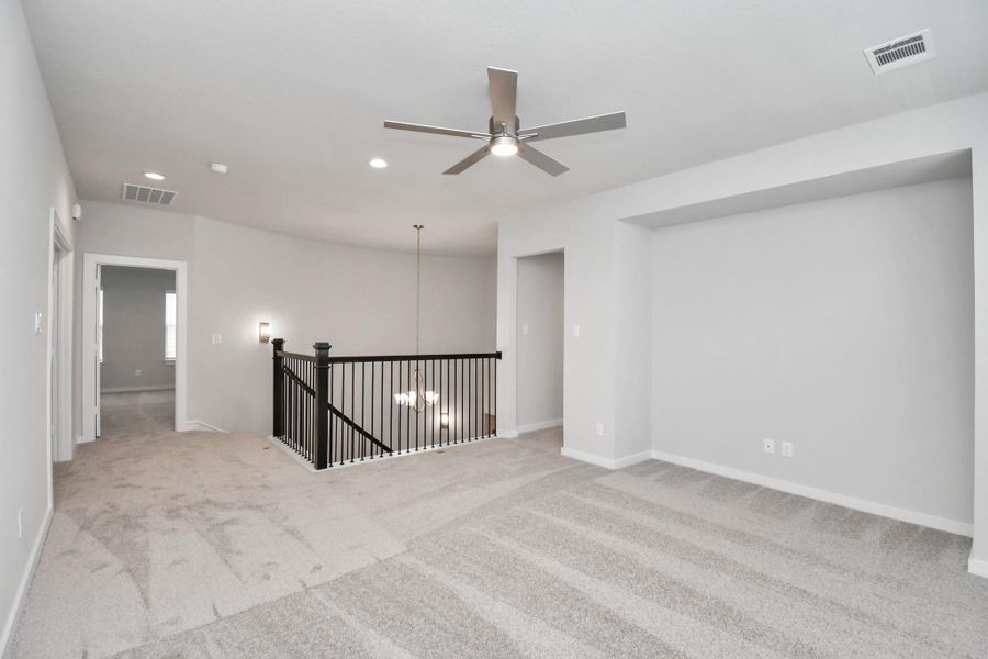 Come upstairs and enjoy a day of leisure in this fabulous game room! This is the perfect hangout spot or adult game room! Features plush carpet, high ceilings, custom paint and windows for plenty of natural light. Come upstairs and enjoy a day of leisure in this fabulous game room! This is the perfect hangout spot or adult game room! Features plush carpet, high ceilings, custom paint and windows for plenty of natural light.