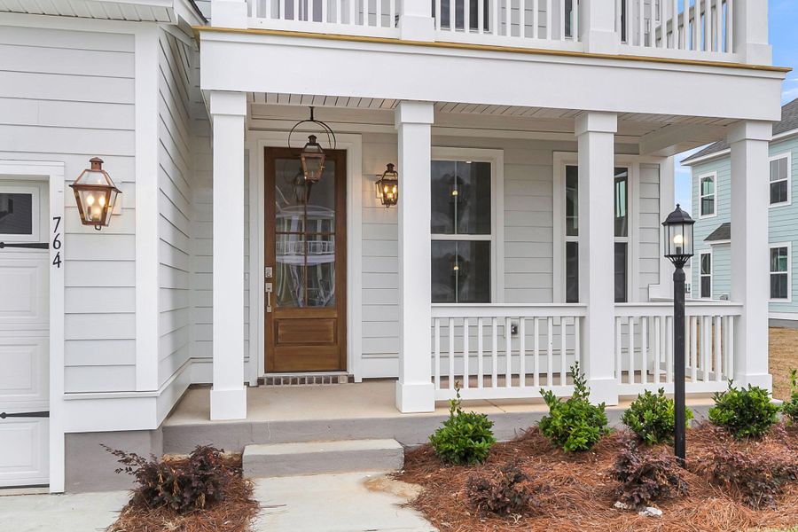 Exterior details and patio area of a home in Tidewater at Lakes of Cane Bay, Summerville (Image 24).
