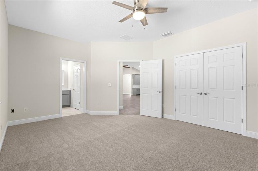 PRIMARY SUITE BEDROOM WITH OVERSIZED WINDOWS -LOTS OF NATURAL LIGHT