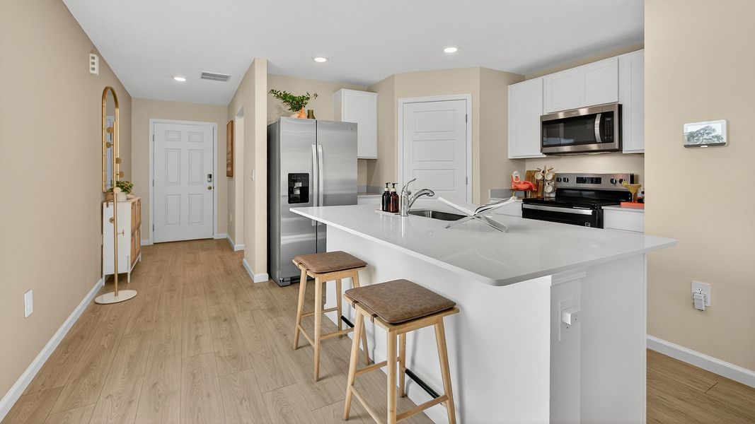 Representative furnished interior of a home built from the GREYSON II by D.R. Horton in Trout River, Jacksonville (Image 7).