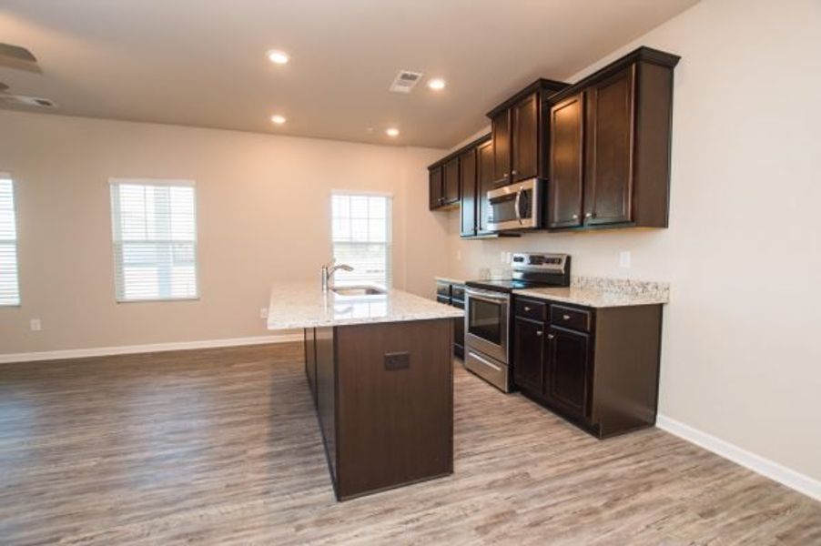 Representative furnished interior of a home built from the Cadence Unit A by Piedmont Residential in Ross Pointe, Kennesaw (Image 5).