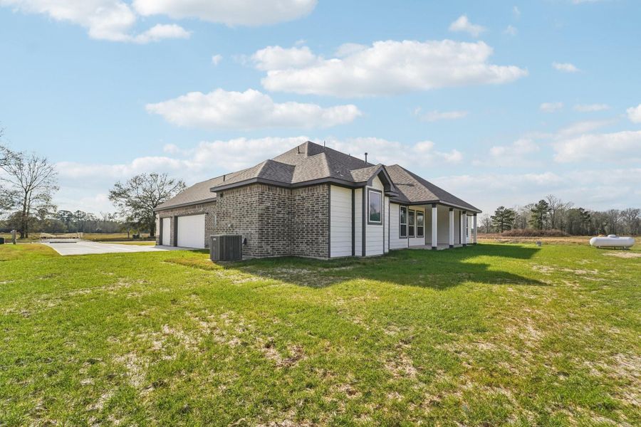 Front exterior of a new home in Barton Place, Cleveland, TX, highlighting curb appeal (Image 2). Front exterior of a new home in Barton Place, Cleveland, TX, highlighting curb appeal (Image 2).
