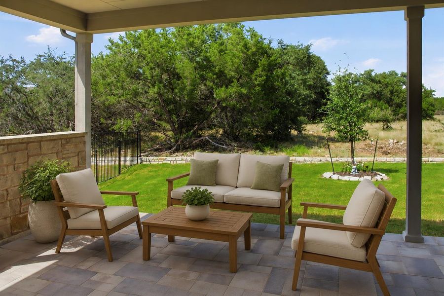 Virtually staged. An inviting covered patio featuring paver flooring and serene outdoor views. Virtually staged. An inviting covered patio featuring paver flooring and serene outdoor views.