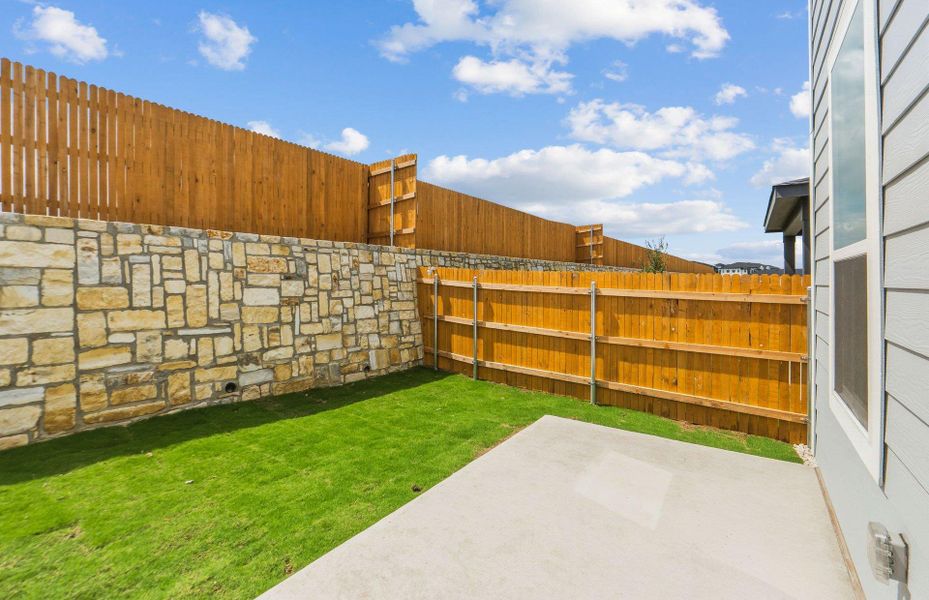 Exterior details and patio area of a home in Cameron Place, Manor (Image 22).
