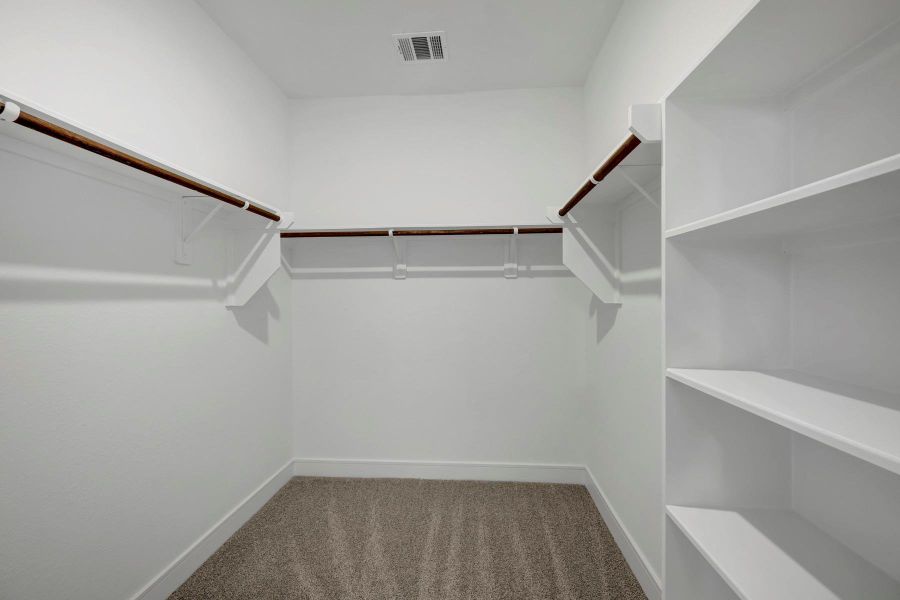 Primary walk-in closet (*Photo not of actual home and used for illustration purposes only.)