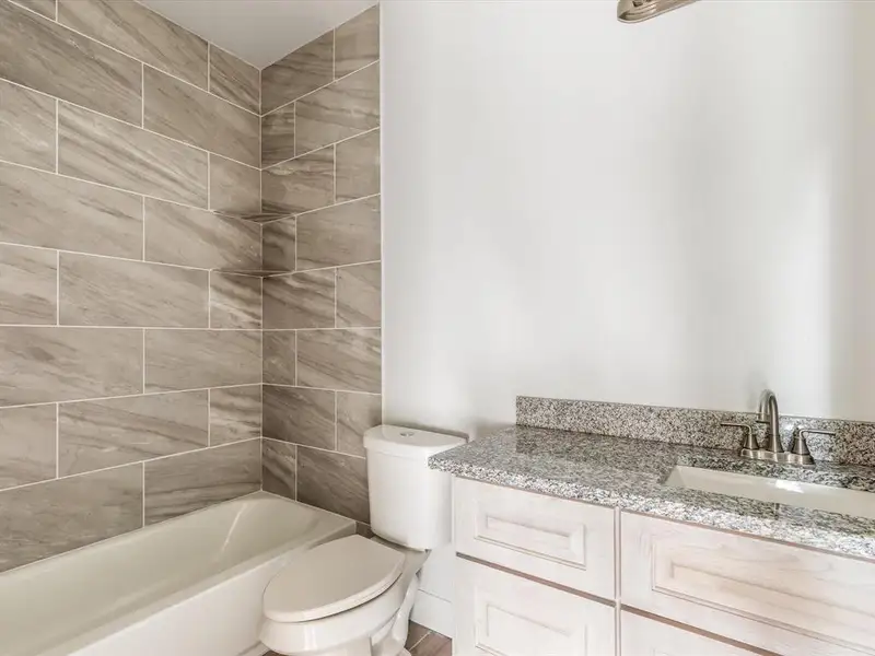 Full bathroom with vanity and shower / washtub combination Full bathroom with vanity and shower / washtub combination