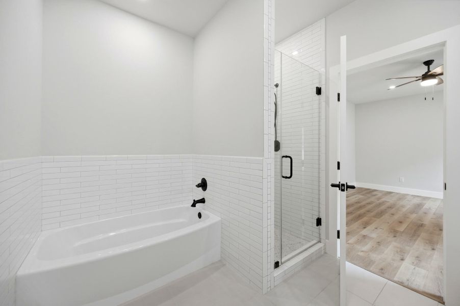 A well-appointed bathroom with clean white subway tile and modern fixtures. A well-appointed bathroom with clean white subway tile and modern fixtures.