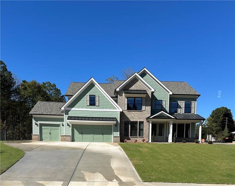 Front exterior of a new home in , Loganville, GA, highlighting curb appeal (Image 1). Front exterior of a new home in , Loganville, GA, highlighting curb appeal (Image 1).