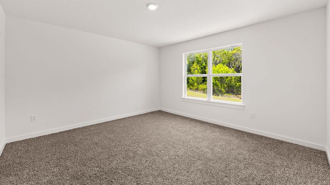 Spacious, unfurnished interior of a new home in Magnolia at the Bluffs Phase 3, Freeport (Image 16).