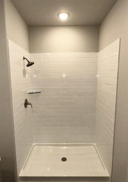 Oversized master shower with ceramic tile walls