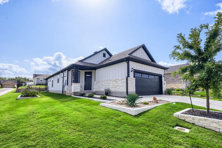 Front exterior of a new home in Sun City Texas, Georgetown, TX, highlighting curb appeal (Image 2). Front exterior of a new home in Sun City Texas, Georgetown, TX, highlighting curb appeal (Image 2).