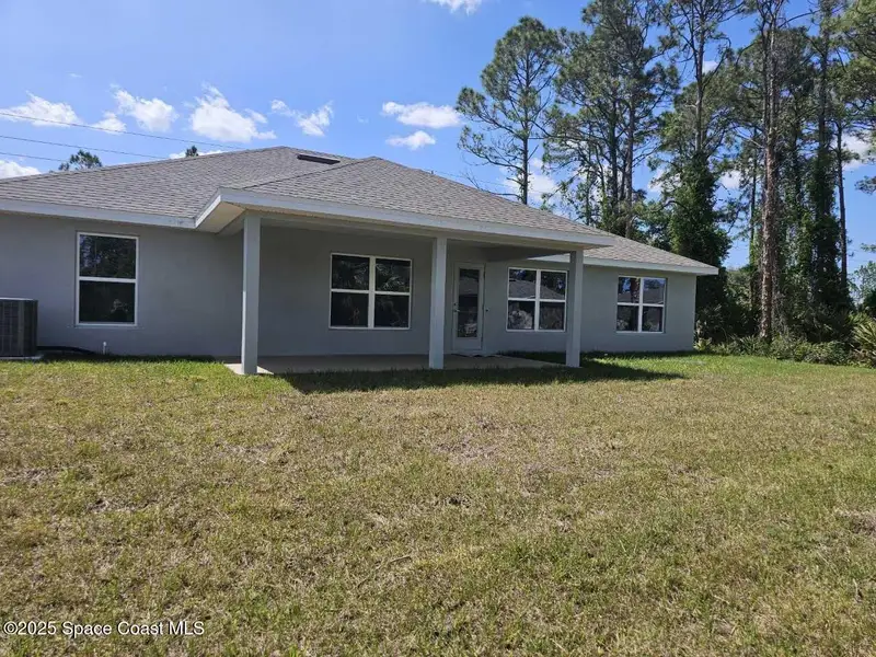 Exterior details and patio area of a home in Palm Bay, Palm Bay (Image 2).