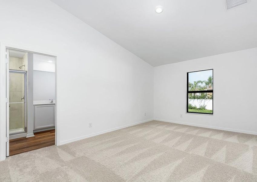 The master bedroom is spacious with access to its own bathroom