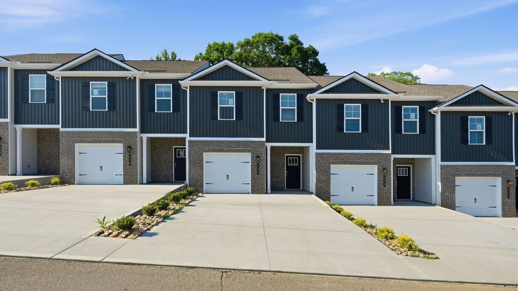 Front exterior of a new home in Macon Townhomes, Seymour, TN, highlighting curb appeal (Image 1). Front exterior of a new home in Macon Townhomes, Seymour, TN, highlighting curb appeal (Image 1).