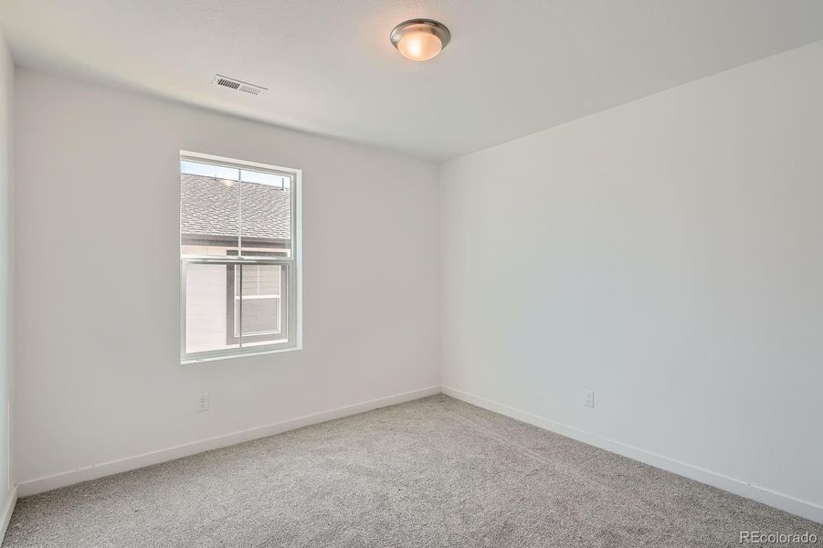 Spacious, unfurnished interior of a new home in Newlin Crossing: The Pioneer Collection, Parker (Image 9).